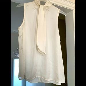 Silk cream sleeve less top